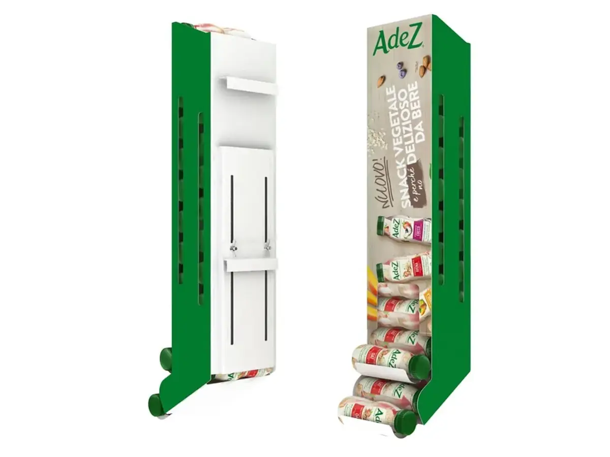 Green shelf-mounted power wing sidekick display with slotted mounting clips, shown blank and branded with AdeZ plant-based drink packaging